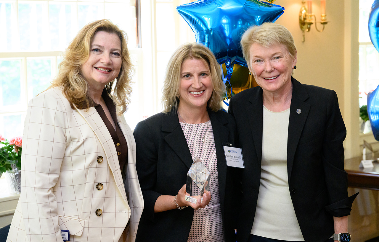 University of Rochester Vice President and Chief Human Resources Officer, Kathleen M. Gallucci (L) and University of Rochester President Sarah Mangelsdorf (R) pose with Meliora Award recipient Caroline Burnicki of the controller’s office during the 2025 President’s Staff Awards Presentation