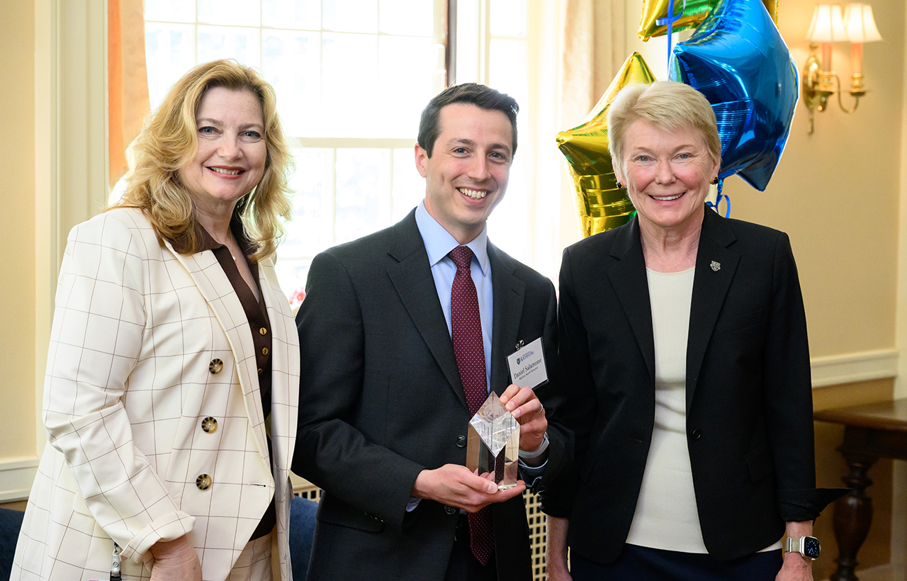 University of Rochester Vice President and Chief Human Resources Officer, Kathleen M. Gallucci (L) and University of Rochester President Sarah Mangelsdorf (R) pose with Meliora Award winner Dan Salamone of human resources during the 2025 President’s Staff Awards Presentation