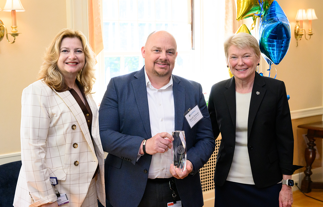 University of Rochester Vice President and Chief Human Resources Officer, Kathleen M. Gallucci (L) and University of Rochester President Sarah Mangelsdorf (R) pose with President’s Spotlight Award recipient David Nelson (center) of University Facilities and Services