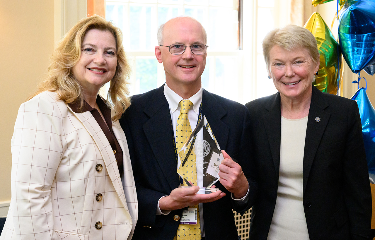 University of Rochester Vice President and Chief Human Resources Officer, Kathleen M. Gallucci (L) and University of Rochester President Sarah Mangelsdorf (R) pose with Witmer Award for Distinguished Service winner Michael Ritz of Medical Center Research Compliance