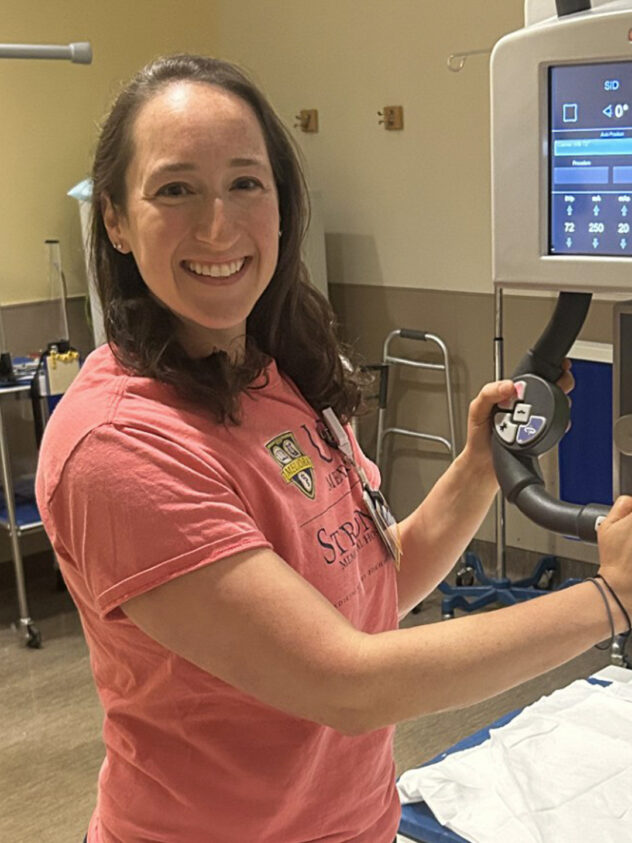 Liz Sacko shows the Carestream DRX Evolution control unit, part of a digital radiography (X-ray) system.