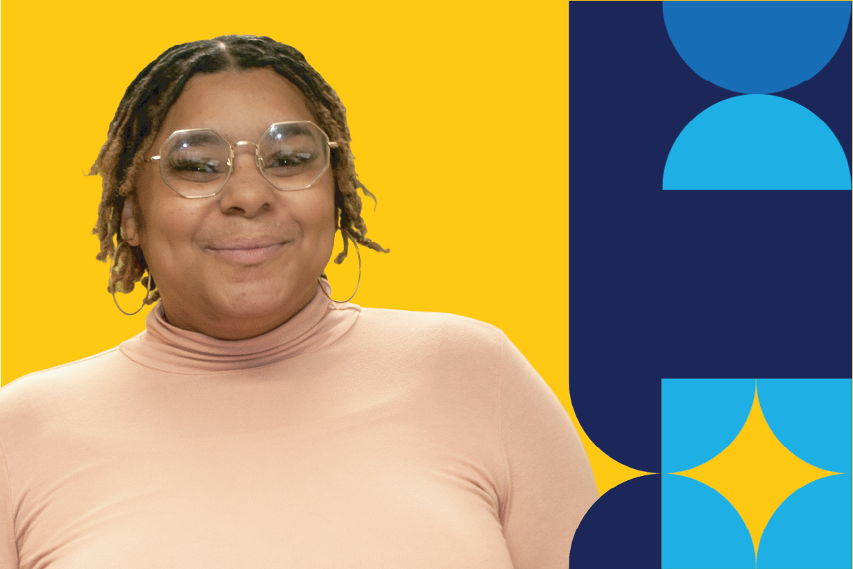 A woman named, Imani Addison, smiling brightly with while wearing a pair of glasses and tan top.