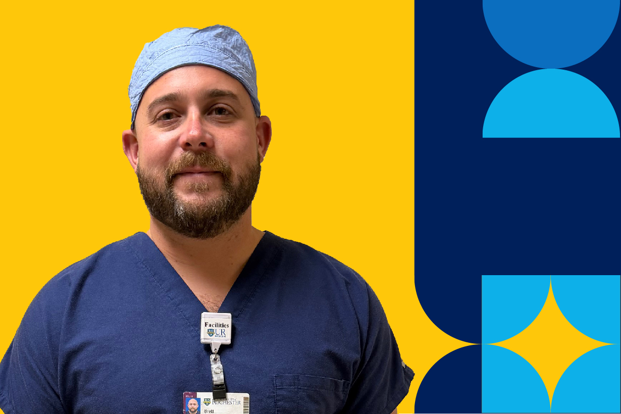 A man named Brett Deisinger in scrubs with a University ID tag on their shirt.