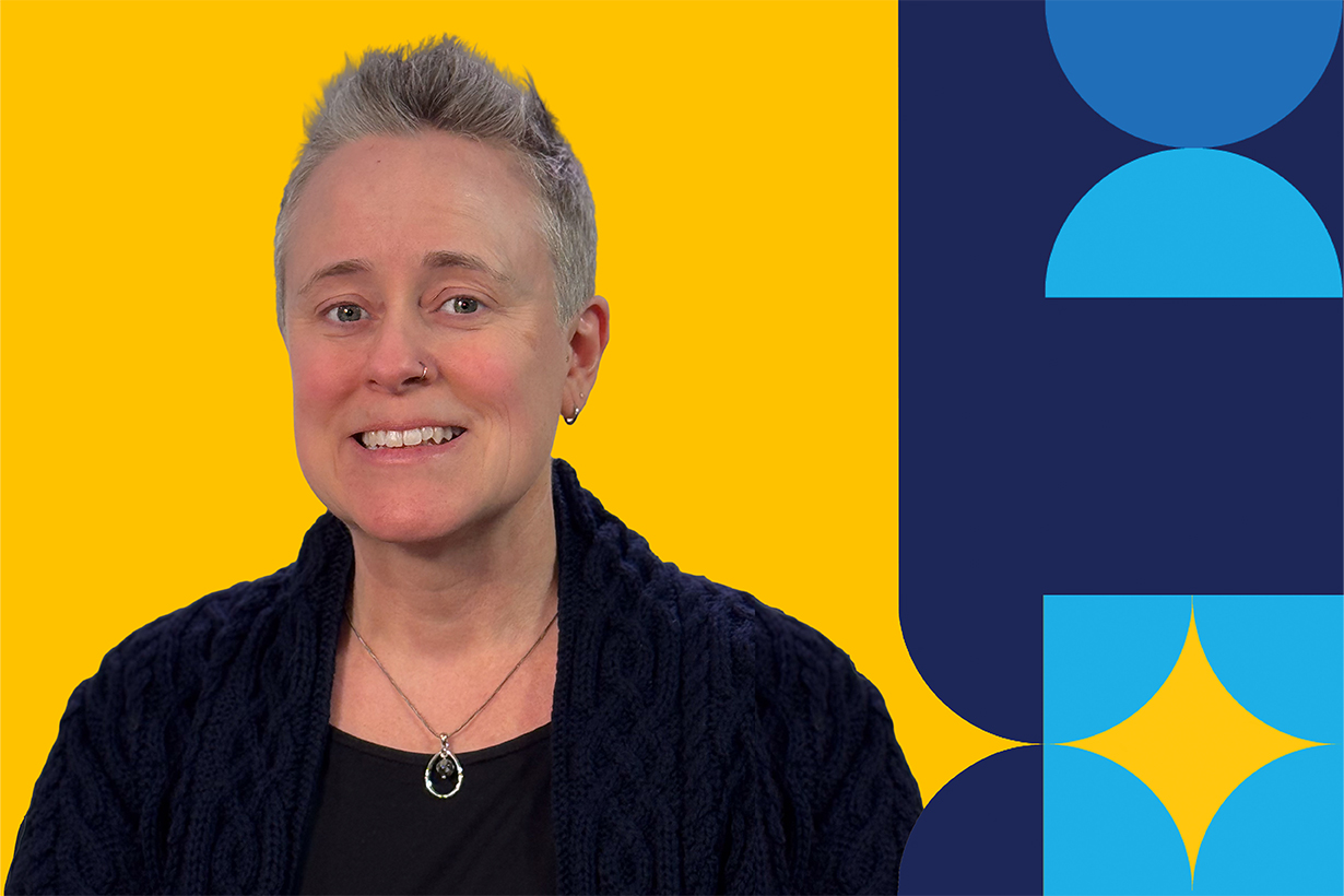 An individual named Wendy Way smiling brightly in front of a yellow background.