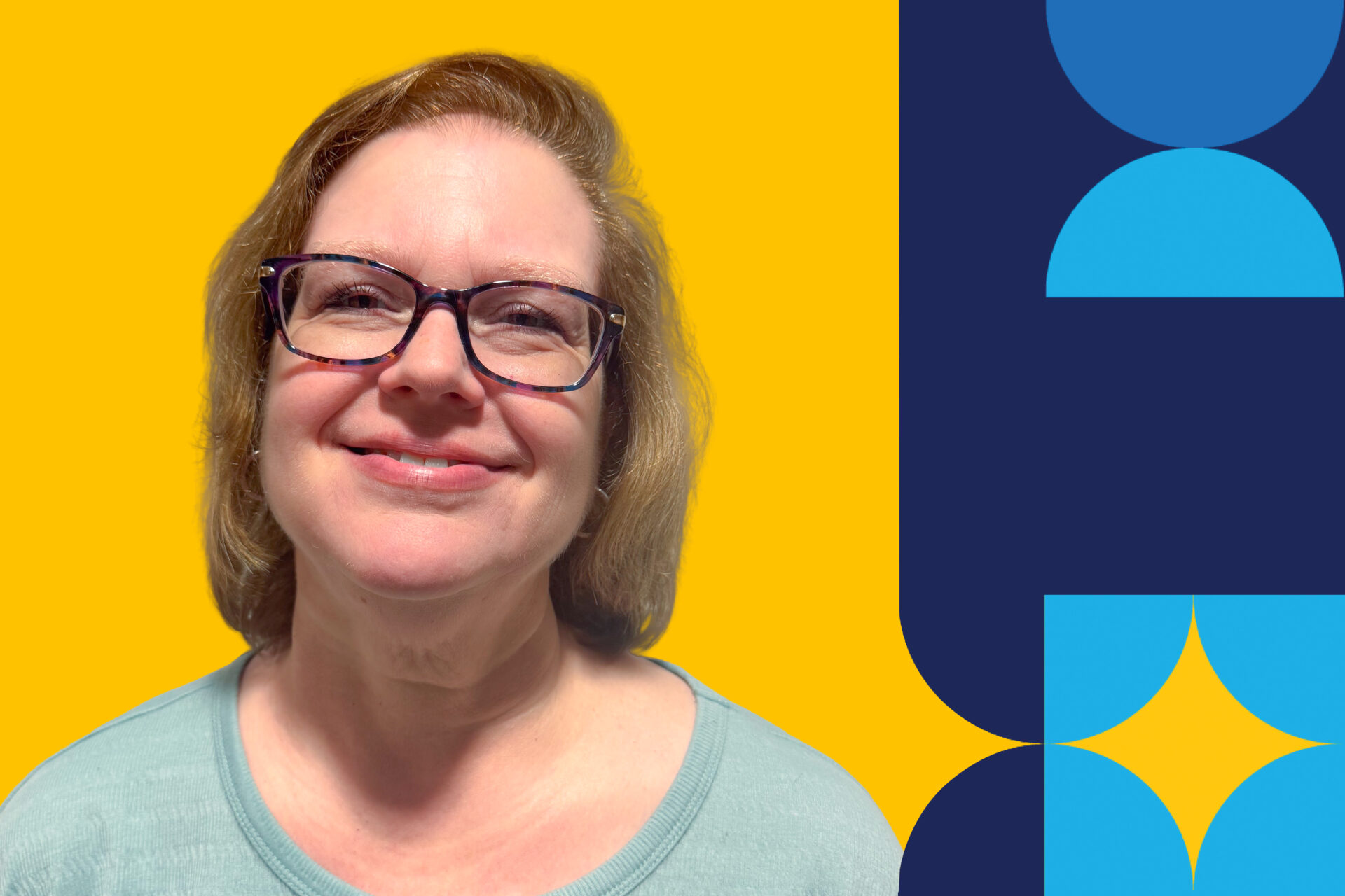 A portrait of Christine Donnelly, a woman, smiles against a yellow background.