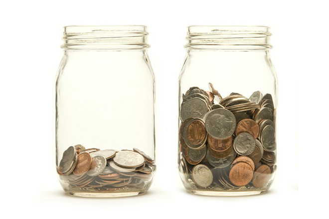 Two glass jars filled with coins