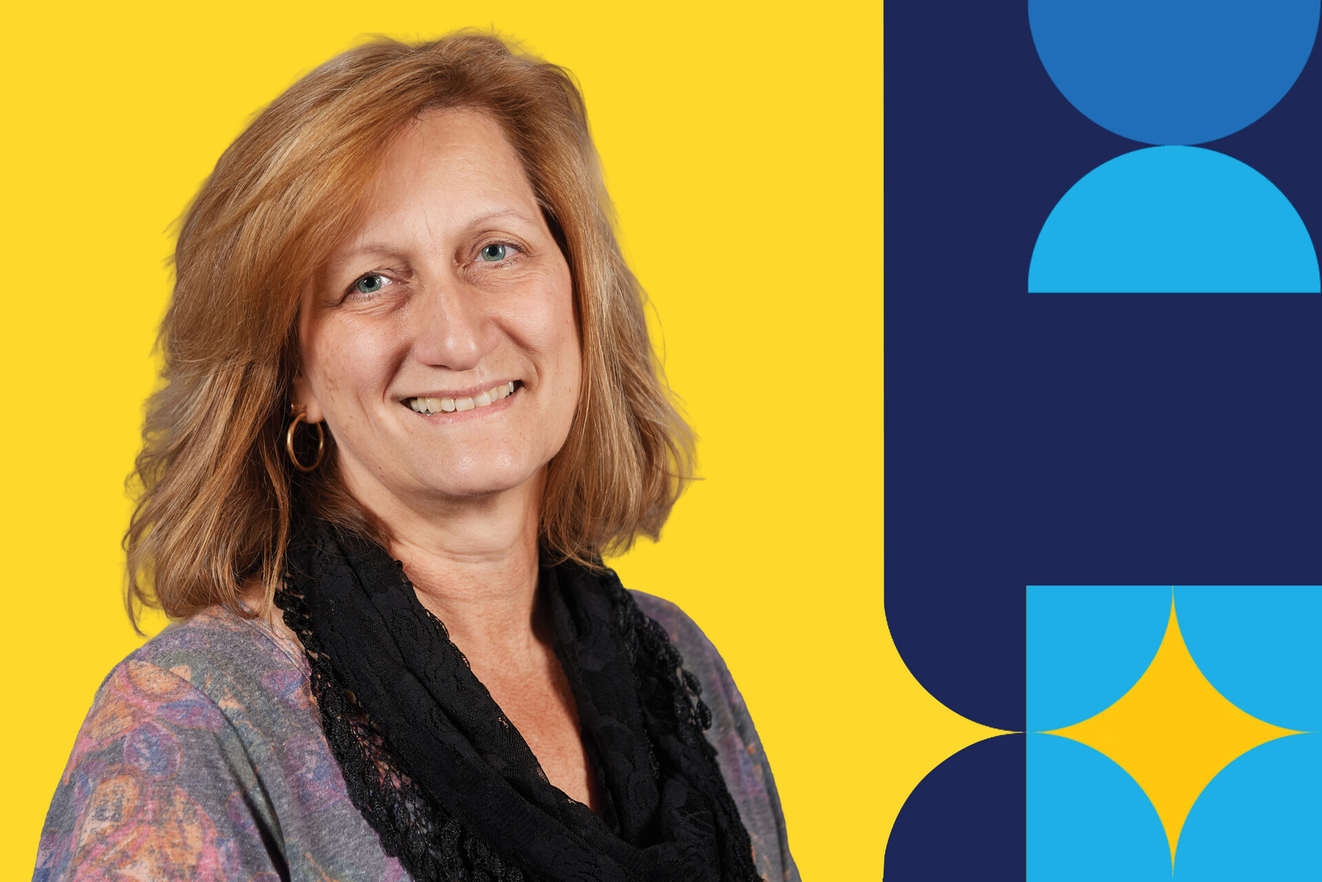 A woman named Elizabeth Lyda smiling brightly in front of a yellow background.