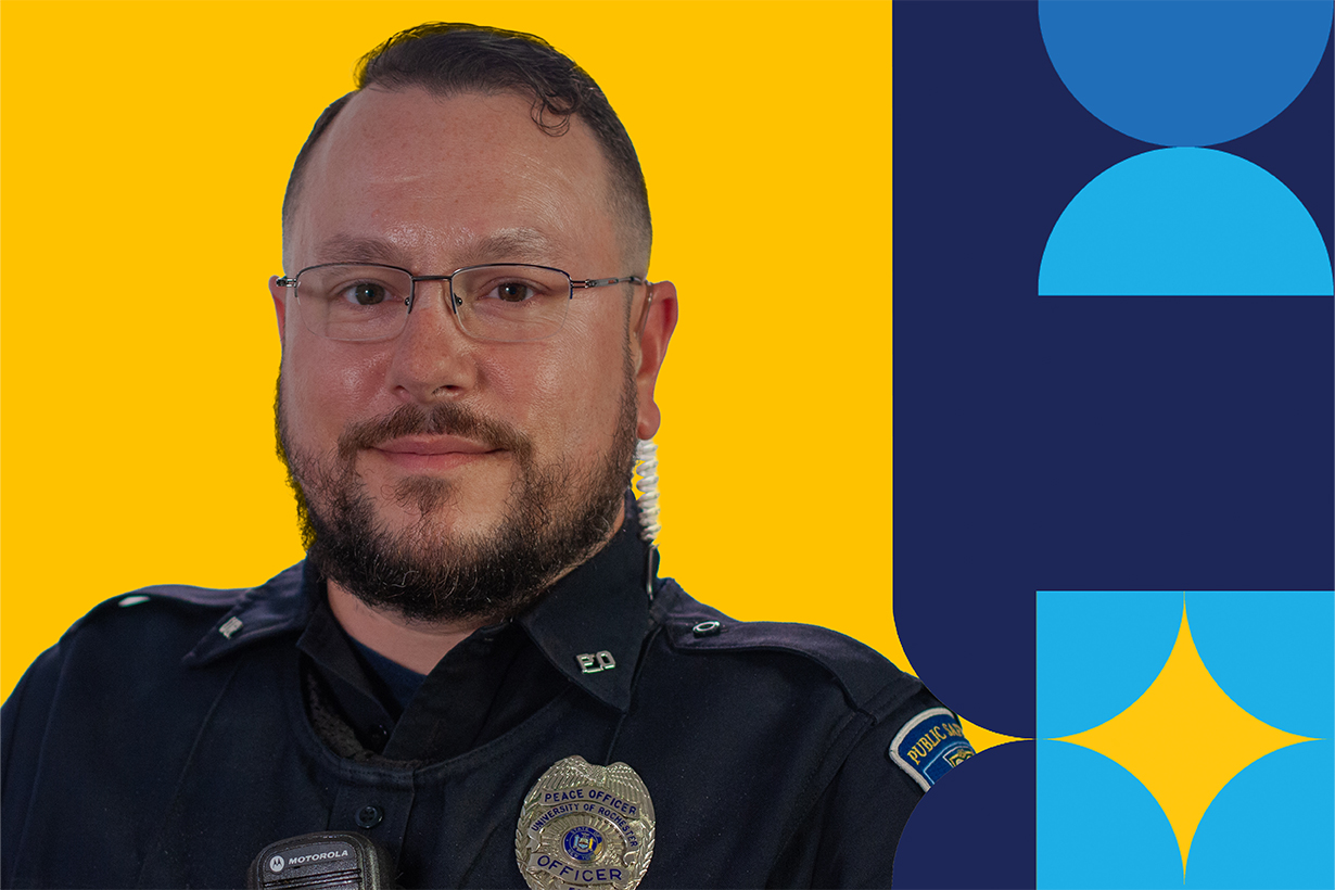 Paul Wlosinski, wearing a peace officer uniform from shoulders up in front of a yellow background with geometric shapes on the right.