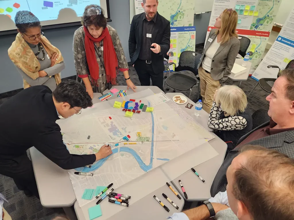 Members of the master planning Executive Steering Committee meeting with design and architecture consultants.