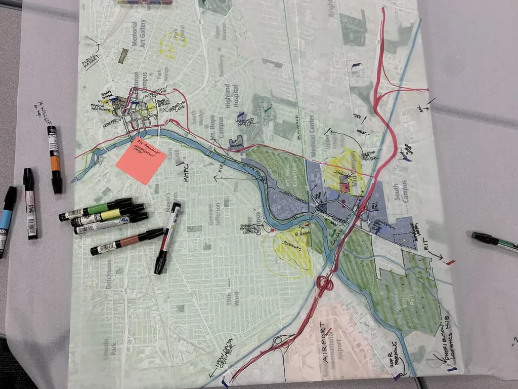 Close up of sketches drawn over a map of the University’s campuses.