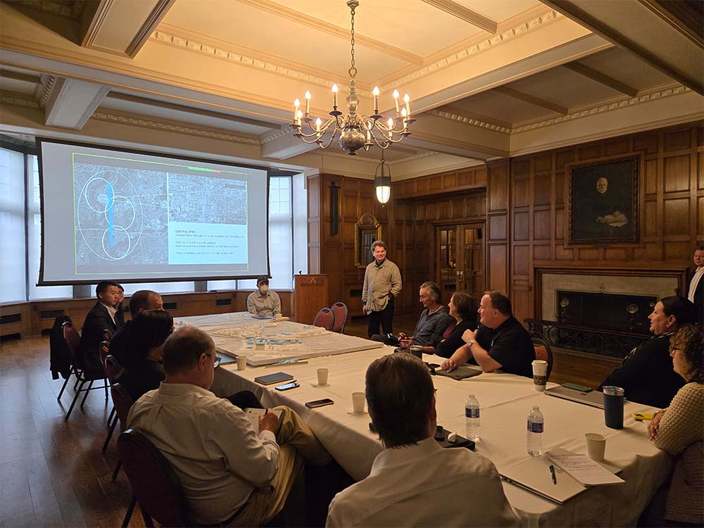Design and architecture consultants share preliminary framework scenarios with the Executive Steering Committee.