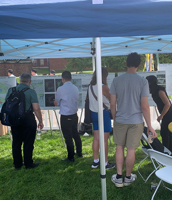 University of Rochester community members at Meliora Weekend view a poster presentation of the preliminary framework plan and share feedback with the design and architecture consultants