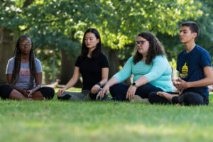 Students meditating on the quad.