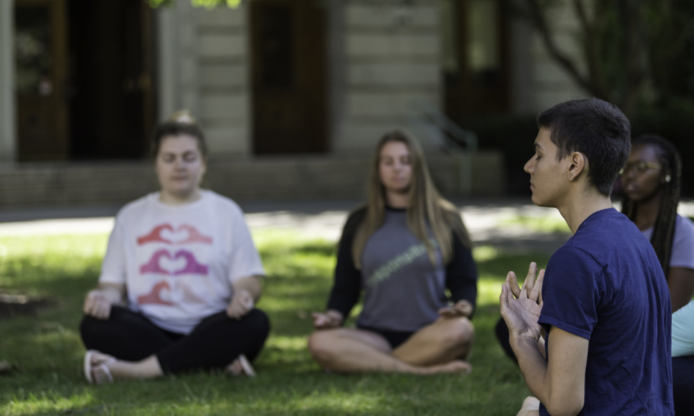 Students meditating on the quad.