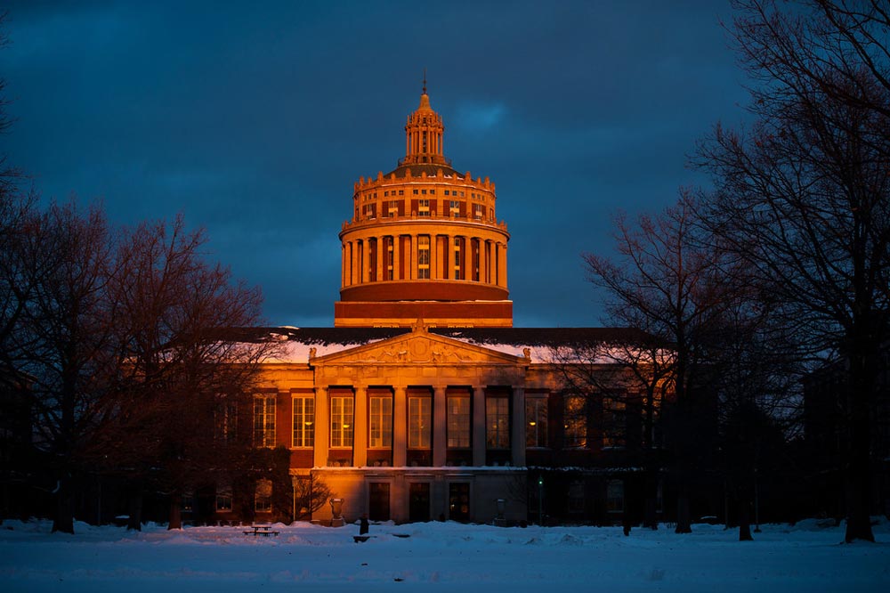 Rush Rhees Library in the snow at sunset