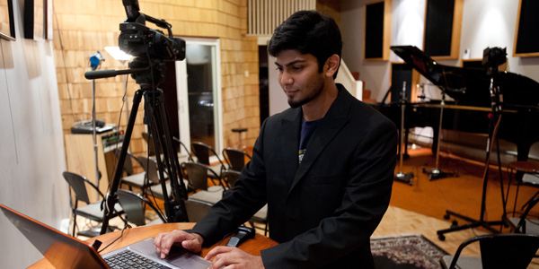 student in studio with laptop