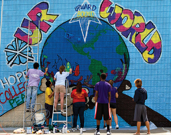 Feature image students painting the earth on a mural