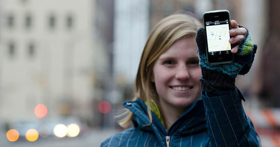 Feature image girl holding mobile phone up to show screen