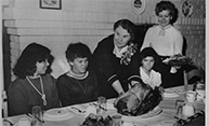 Feature image family at table for dinner