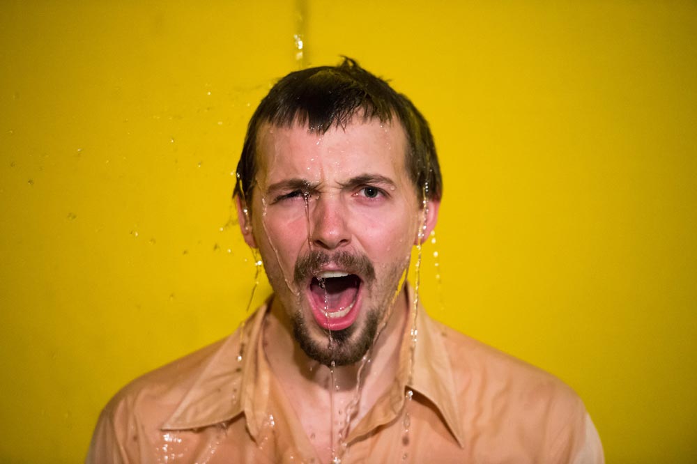Feature image student actor shouts at camera as water is poured over his head