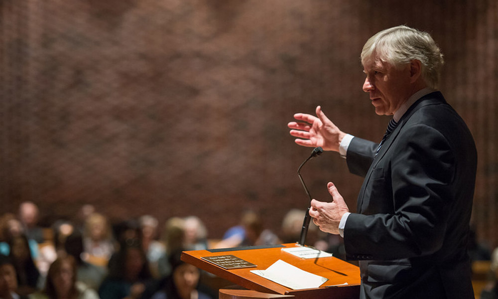 Feature image Lee Bollinger speaking at a podium