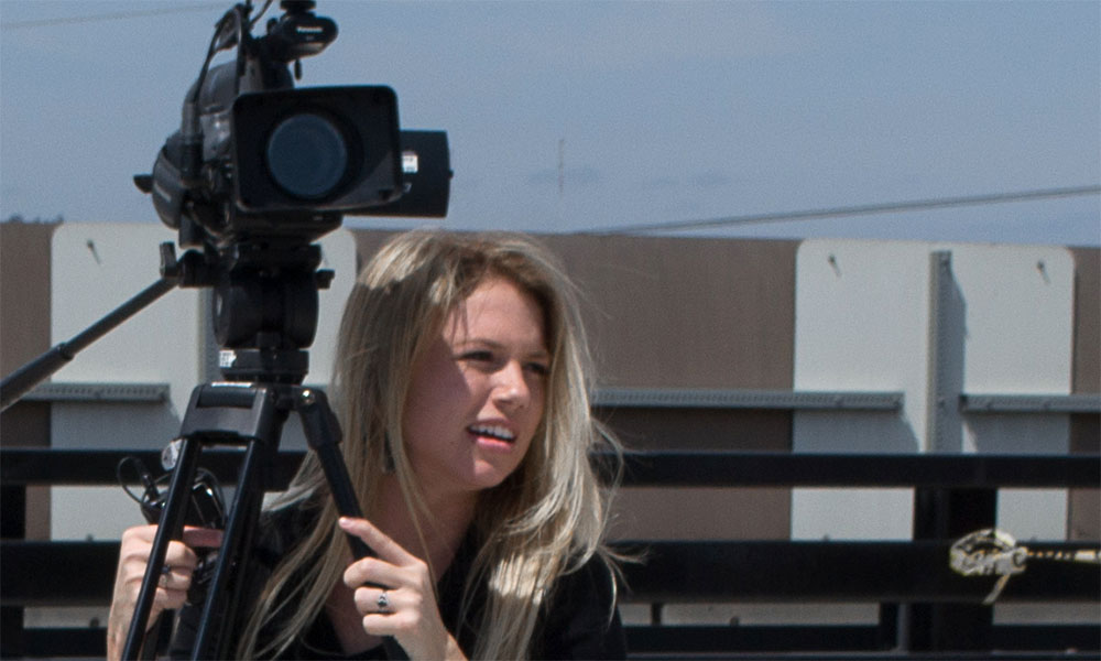 Feature image woman behind film camera