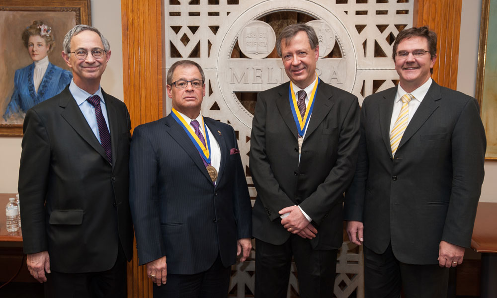 Feature image President Joel Seligman, Professor Robert L. McCrory, Professor Riccardo Betti and Dean Robert Clark,