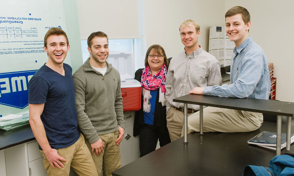 students posing with their Design Day project