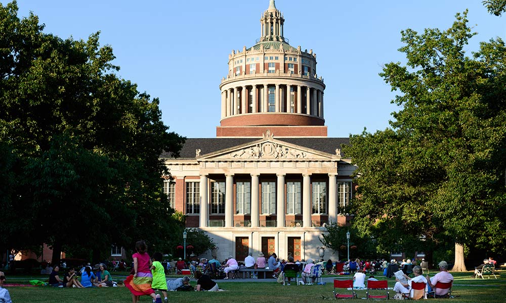people in lawnchairs on the quad in front of Rush Rhees