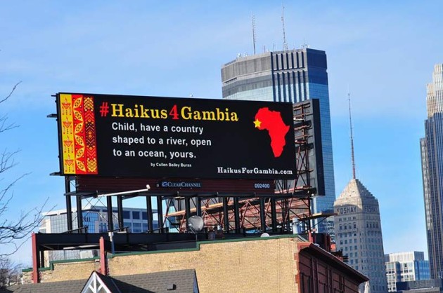 Sign on top of building: '#Haikus4Gambia'