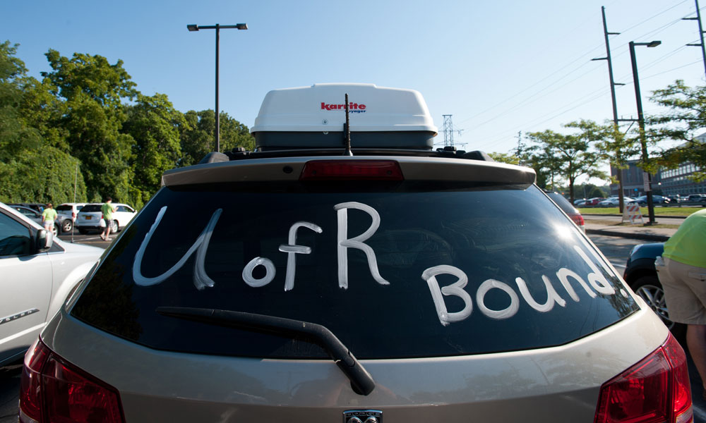 Feature image a car packed with stuff with the words UofR Bound painted on the rear window