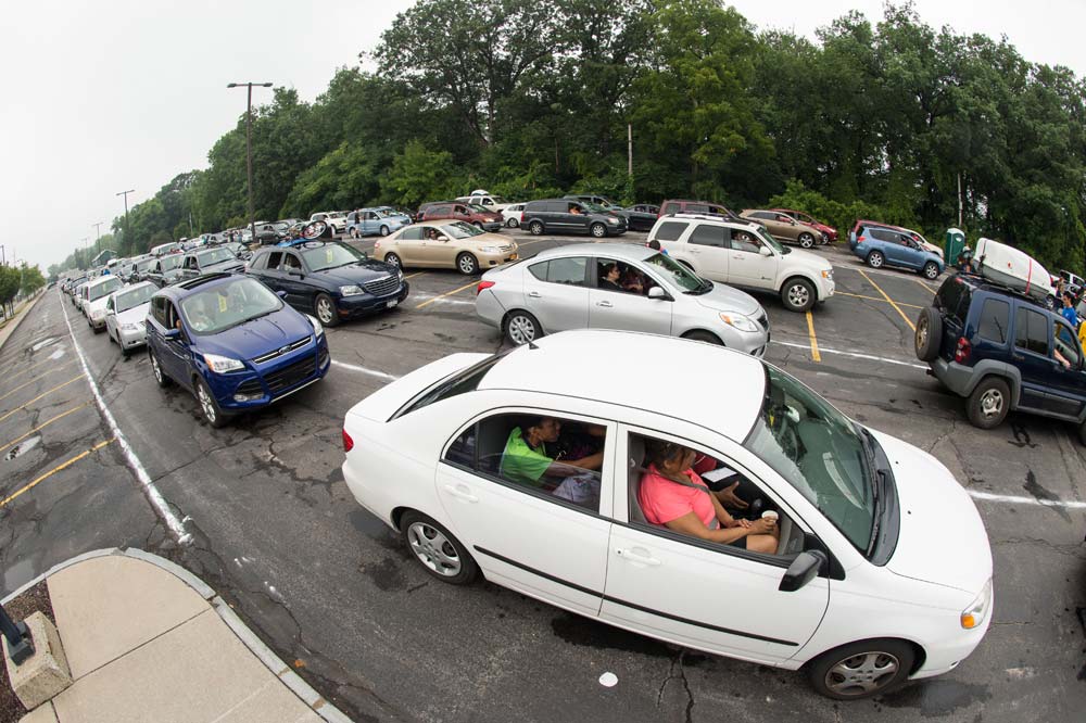 parking lot full of long lines of cars