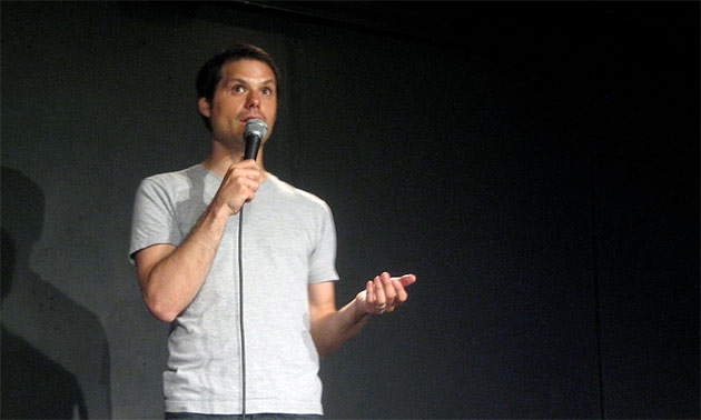 Feature image man on stage talking in mic