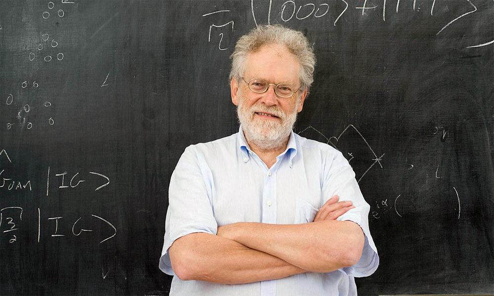 Feature image man in front of blackboard