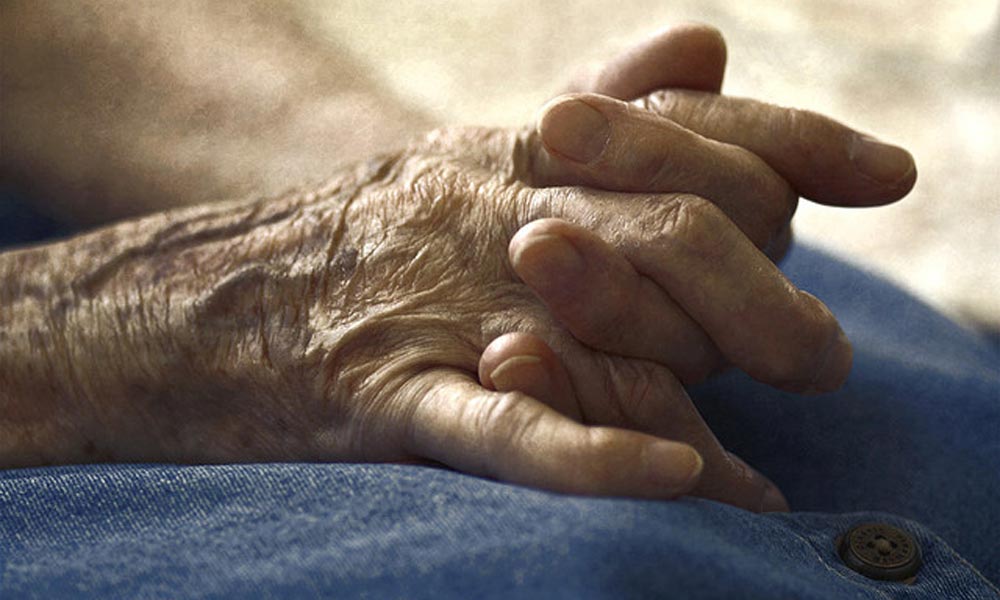 Feature image close-up photo of elderly person's hands