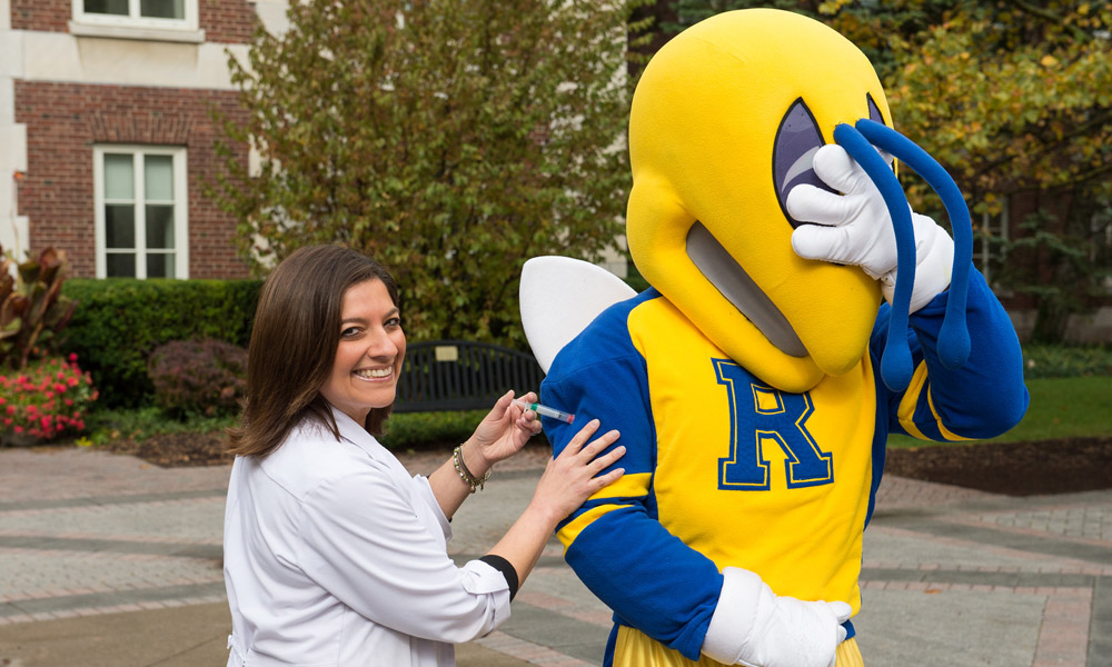 Feature image Rocky mascot getting a flu shot from a nurse