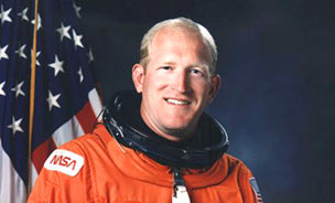 Feature image man in orange astronaut suit