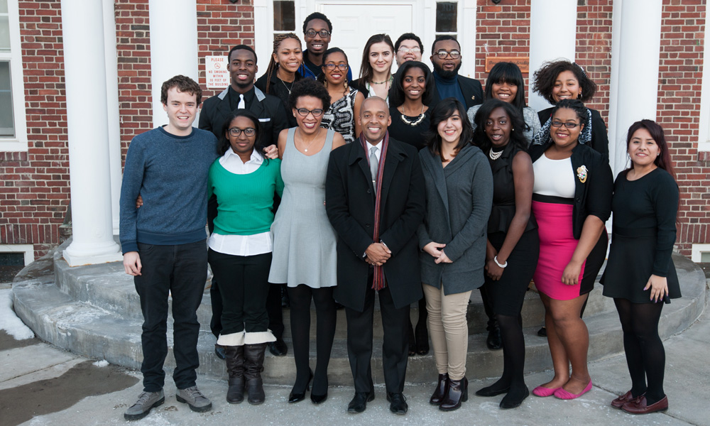 Feature image group portrait of speaker Khalil Muhammad with students