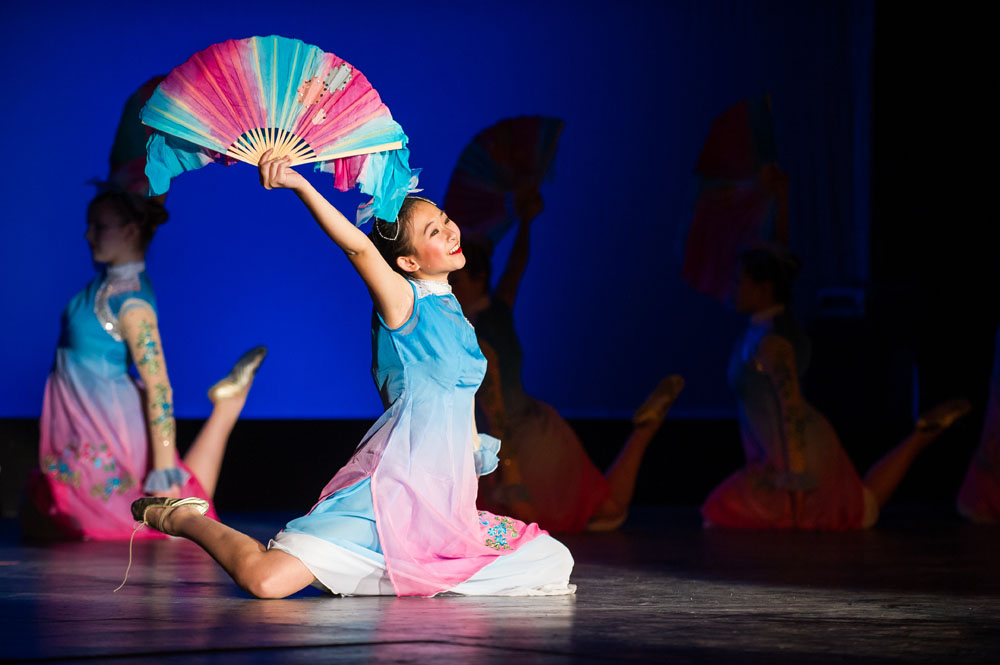 Feature image student performing with ornate fan