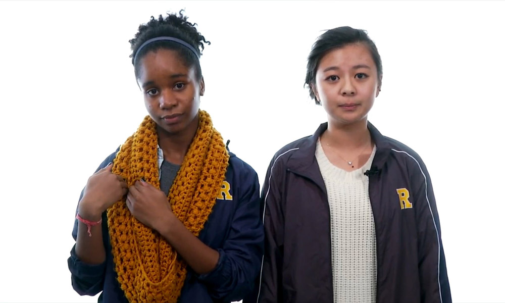Feature image video still features two students speaking to camera