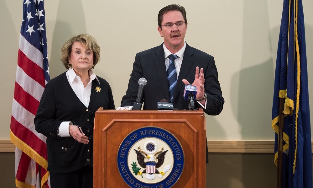 Louise Slaughter and Rob Clark behind a podium