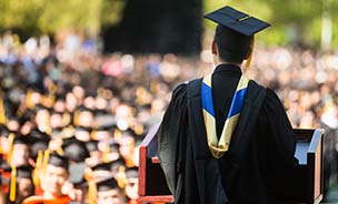 Feature image speaker addressing grads at commencement