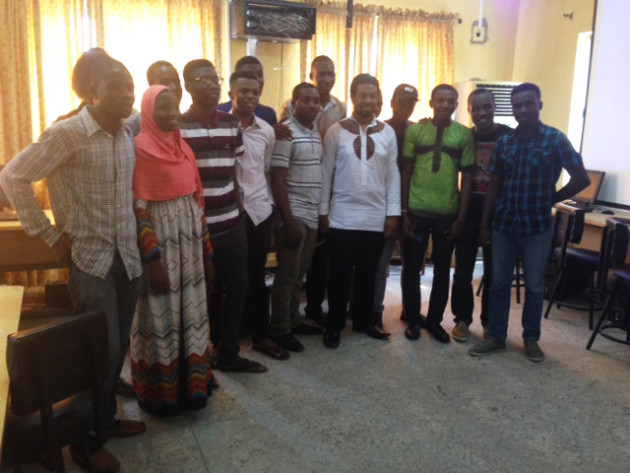 Abiola with students at the University of Lagos