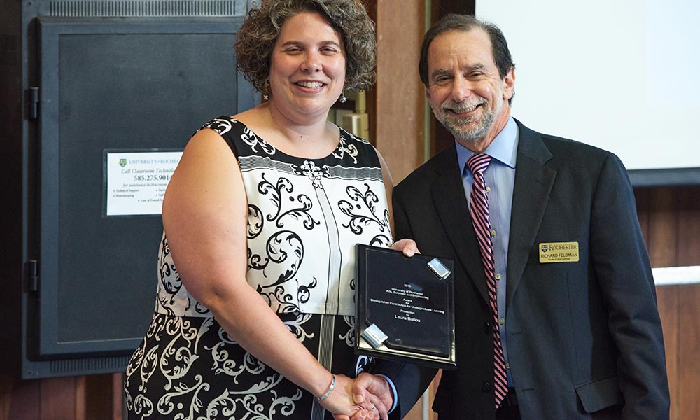 Feature image Laura Ballou shakes hands with Rich Feldman