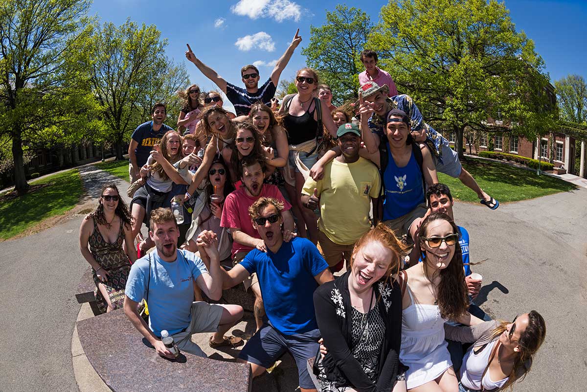 Feature image large group of students shouting and cheering on the quad