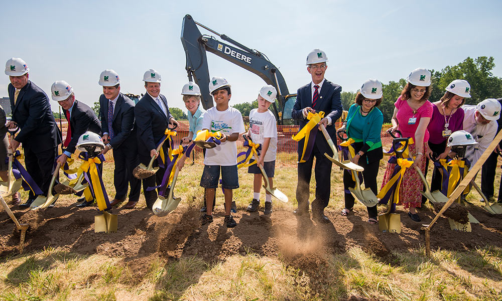 Feature image people in hardhats with shovels