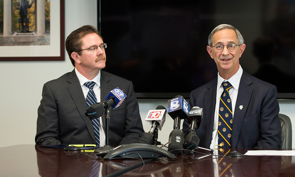 Feature image Rob Clark and Joel Seligman at press conference