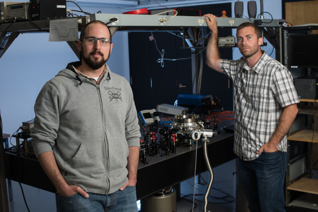 two men and lab equipment