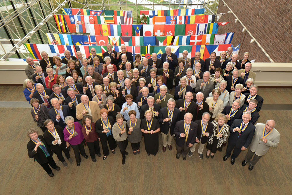 Members of the Class of 1965 pose for a class photo after receiving University medallions to mark their 50th Reunion.