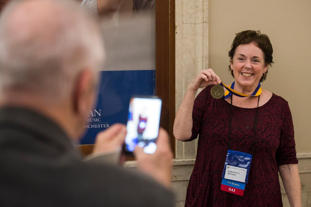 Linda Kinyon McClusky ’65E poses for a photo with her University medallion after a ceremony recognizing the 50th Reunion Class of 1965.